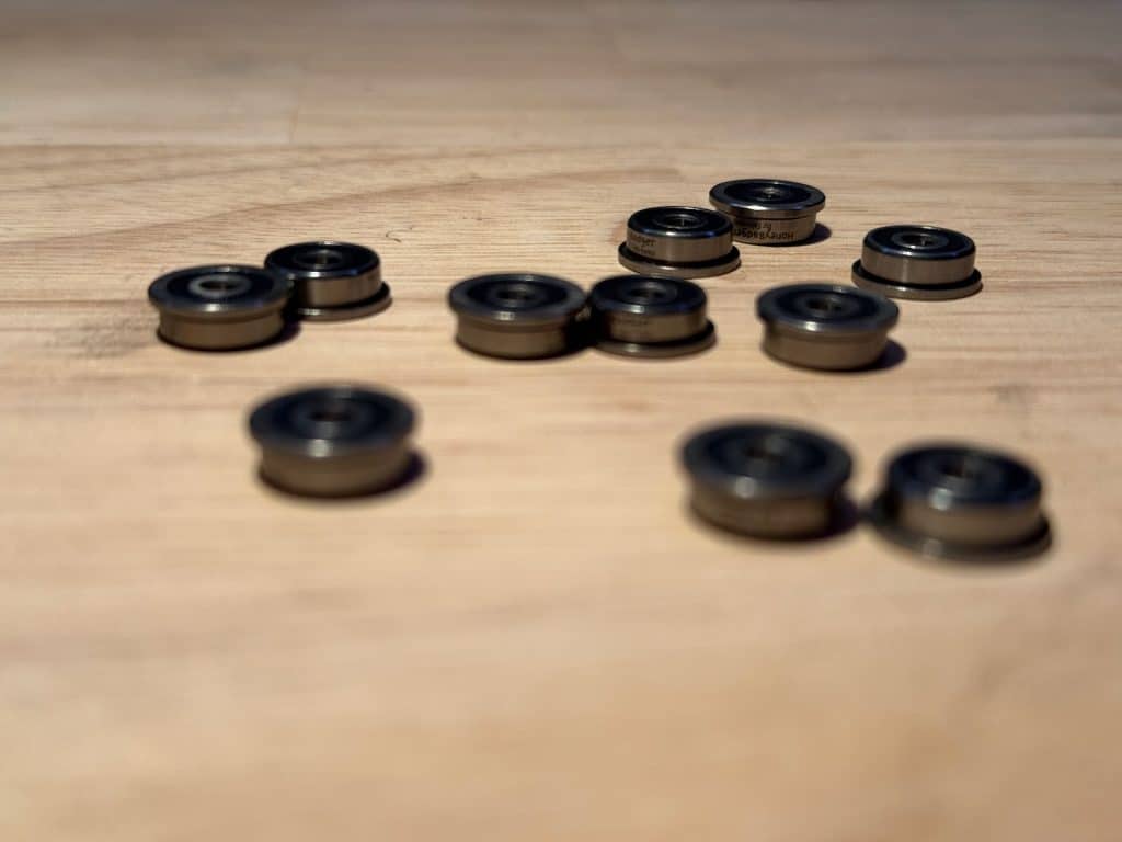 Honeybadger F623-2RS bearings on a wood table